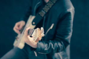 a man playing a guitar